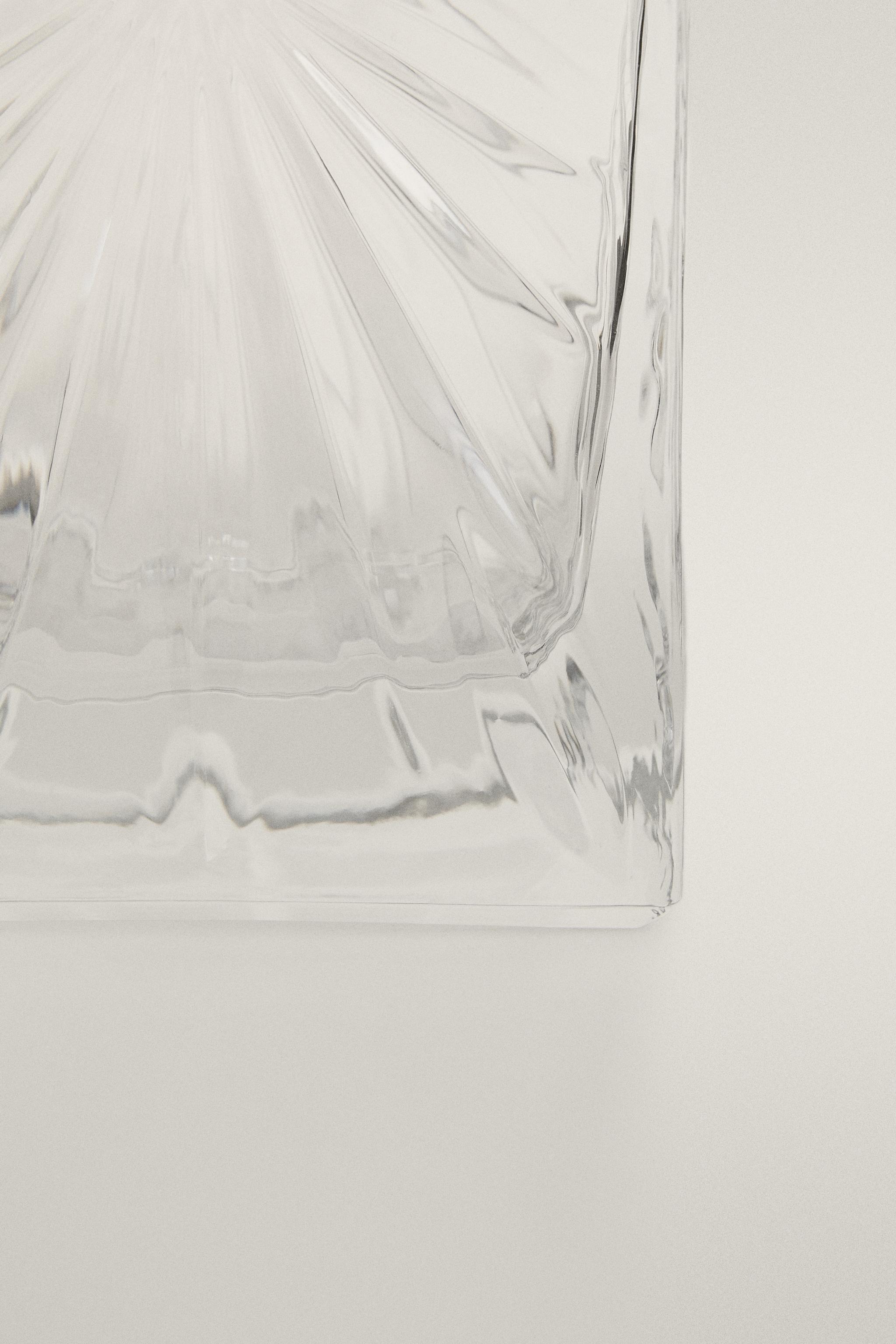 CRYSTALLINE BOTTLE WITH RAISED DESIGN